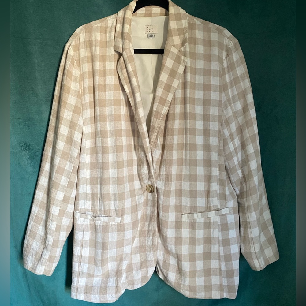 It’s a beige checkerboard blazer and short’s set! Very trendy and classic.